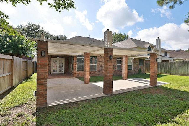 9111 Sutter Ranch Dr, Houston, TX 77064 - rear view of house featuring french doors, a patio area, a fenced backyard, and brick siding