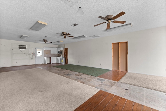 6738 US Highway 190 E, Livingston, TX 77351 - garage featuring a ceiling fan and a wall unit AC