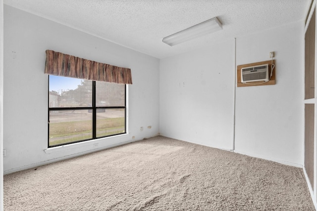 6738 US Highway 190 E, Livingston, TX 77351 - carpeted spare room featuring a wall mounted air conditioner and a textured ceiling