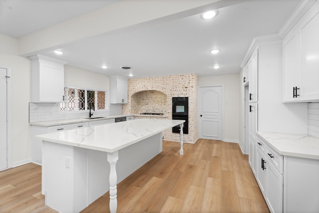 3 Briarwood Dr, Conroe, TX 77301 - kitchen with a fireplace, tasteful backsplash, white cabinets, and recessed lighting