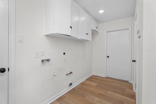 3 Briarwood Dr, Conroe, TX 77301 - washroom with gas dryer hookup, light wood finished floors, hookup for an electric dryer, washer hookup, and cabinet space