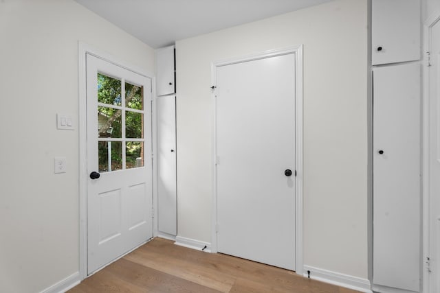 3 Briarwood Dr, Conroe, TX 77301 - entryway with light wood-style flooring and baseboards