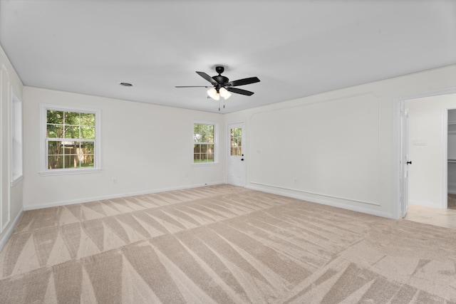3 Briarwood Dr, Conroe, TX 77301 - spare room featuring light carpet, healthy amount of natural light, and a ceiling fan