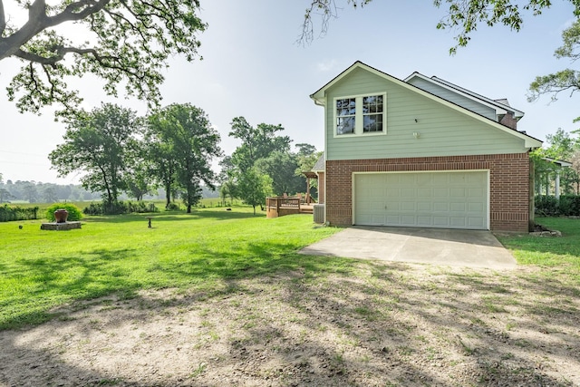 13141 Nicholson Rd, Conroe, TX 77303 - view of property exterior featuring a garage, brick siding, driveway, and a lawn