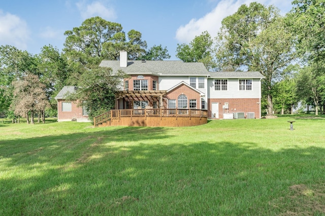 13141 Nicholson Rd, Conroe, TX 77303 - back of house featuring a deck, a pergola, brick siding, a chimney, and a yard