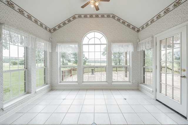 13141 Nicholson Rd, Conroe, TX 77303 - unfurnished sunroom with wallpapered walls, vaulted ceiling, and plenty of natural light
