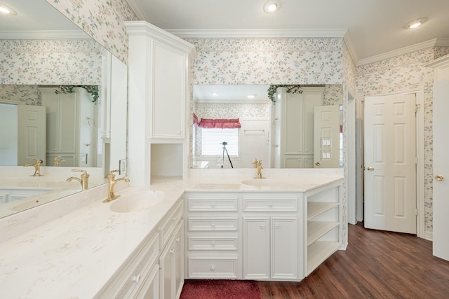 13141 Nicholson Rd, Conroe, TX 77303 - bathroom featuring wallpapered walls, double vanity, crown molding, and wood finished floors