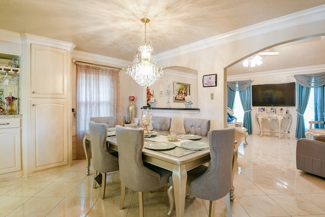 9411 Kingsvalley St, Houston, TX 77075 - dining room featuring arched walkways, a chandelier, light tile patterned floors, and crown molding