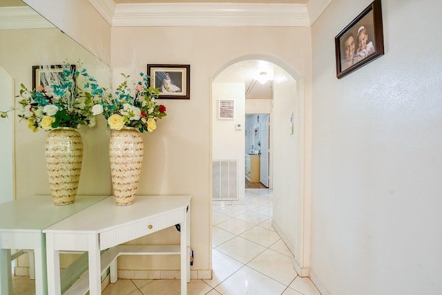 9411 Kingsvalley St, Houston, TX 77075 - hallway with arched walkways, light tile patterned floors, and crown molding