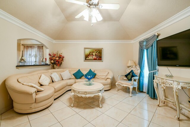 9411 Kingsvalley St, Houston, TX 77075 - living area with light tile patterned floors, ceiling fan, vaulted ceiling, ornamental molding, and arched walkways