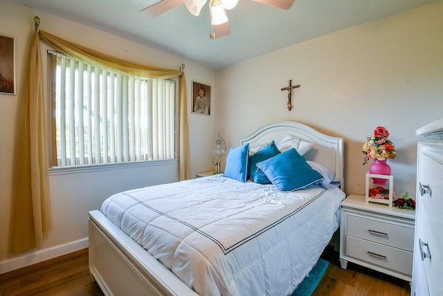 9411 Kingsvalley St, Houston, TX 77075 - bedroom featuring multiple windows, wood finished floors, and a ceiling fan
