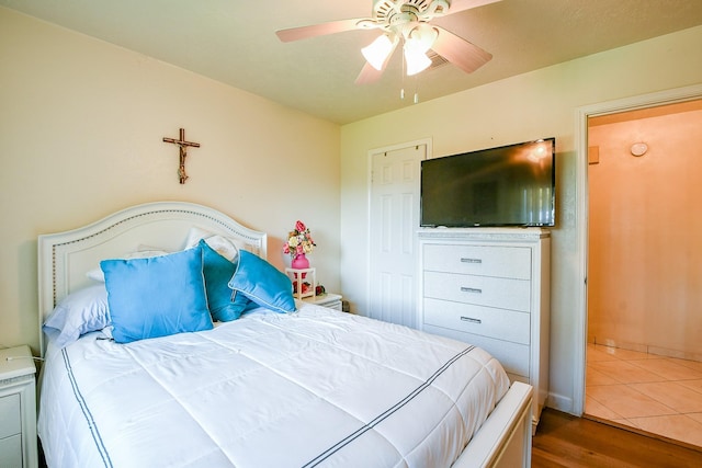 9411 Kingsvalley St, Houston, TX 77075 - bedroom featuring wood finished floors and ceiling fan