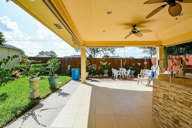 9411 Kingsvalley St, Houston, TX 77075 - fenced backyard with outdoor dining space, a patio, and a ceiling fan