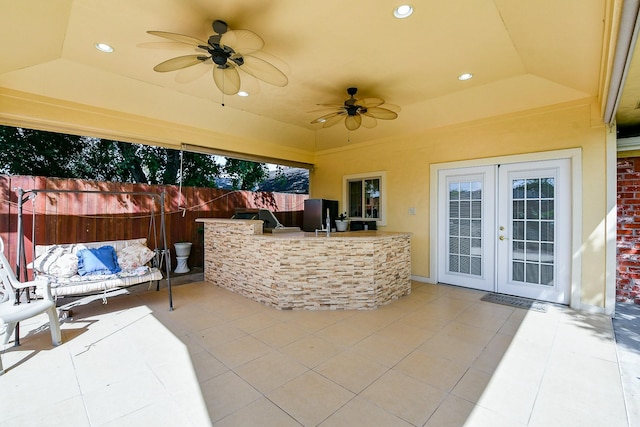 9411 Kingsvalley St, Houston, TX 77075 - view of patio / terrace with french doors, an outdoor bar, a ceiling fan, and exterior kitchen
