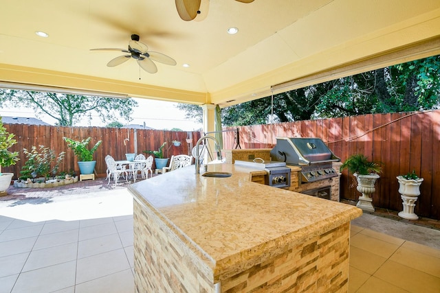 9411 Kingsvalley St, Houston, TX 77075 - fenced backyard featuring an outdoor kitchen, outdoor dining area, a patio area, and a ceiling fan