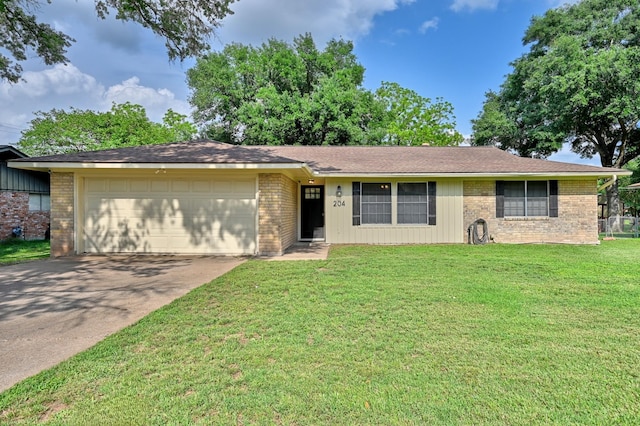204 Meadow Ln, Brenham, TX 77833 - single story home featuring concrete driveway, brick siding, an attached garage, and a front lawn