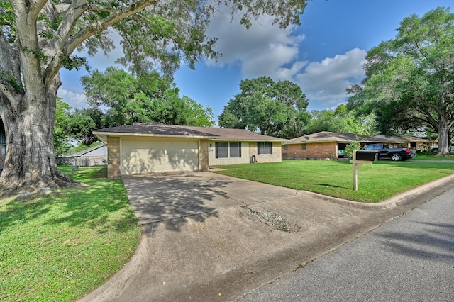 204 Meadow Ln, Brenham, TX 77833 - ranch-style house featuring concrete driveway, brick siding, an attached garage, and a front lawn