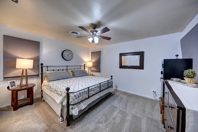 204 Meadow Ln, Brenham, TX 77833 - bedroom featuring light carpet and a ceiling fan