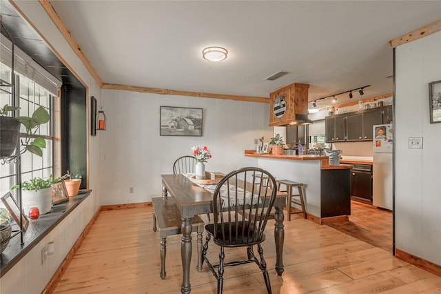 1205 W Houston Ave W, Crockett, TX 75835 - dining space with light wood finished floors and baseboards
