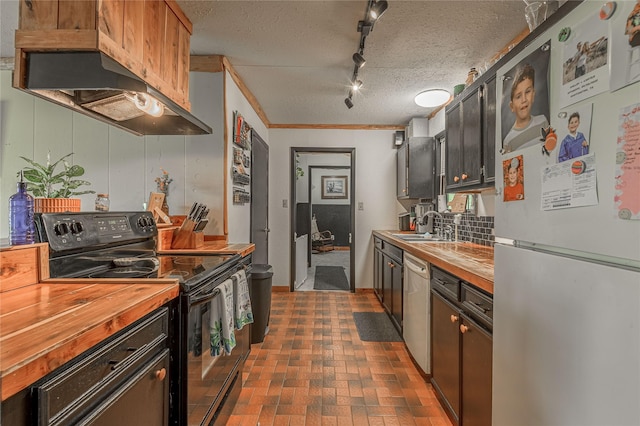 1205 W Houston Ave W, Crockett, TX 75835 - kitchen featuring freestanding refrigerator, black range with electric stovetop, wood counters, extractor fan, and a textured ceiling