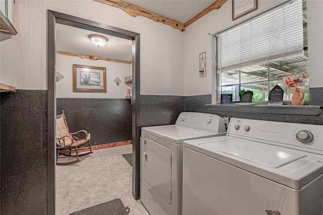 1205 W Houston Ave W, Crockett, TX 75835 - laundry area with independent washer and dryer, light floors, and a textured wall