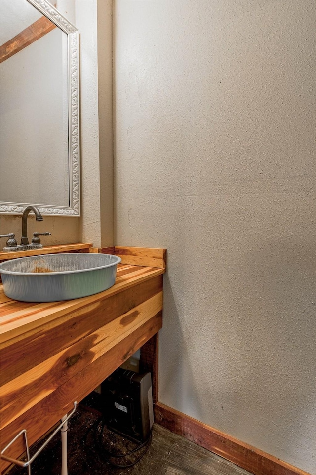 1205 W Houston Ave W, Crockett, TX 75835 - bathroom with vanity and wood finished floors