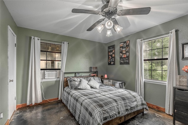 1205 W Houston Ave W, Crockett, TX 75835 - bedroom with concrete floors, ceiling fan, a textured wall, and cooling unit