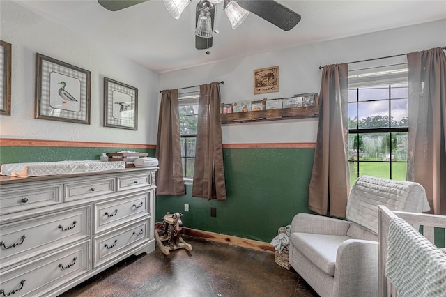 1205 W Houston Ave W, Crockett, TX 75835 - bedroom featuring concrete floors and ceiling fan