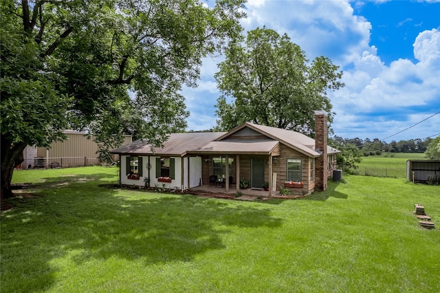 1205 W Houston Ave W, Crockett, TX 75835 - back of house featuring a chimney