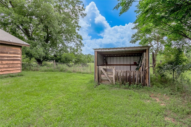 1205 W Houston Ave W, Crockett, TX 75835 - view of green lawn with an outdoor structure and an outbuilding