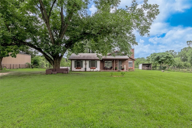 1205 W Houston Ave W, Crockett, TX 75835 - rear view of property with a chimney