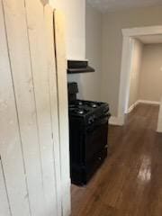 3109 Anita St, Houston, TX 77004 - kitchen featuring stove, ventilation hood, and wood finished floors