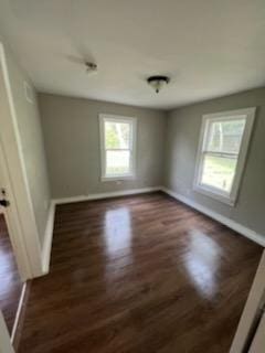 3109 Anita St, Houston, TX 77004 - empty room featuring baseboards and dark wood finished floors