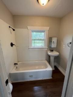 3109 Anita St, Houston, TX 77004 - bathroom featuring a bath and wood finished floors
