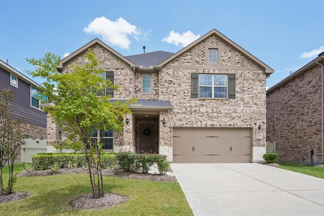 10126 Bayou Oaks Dr, Conroe, TX 77385 - traditional-style home featuring a front yard, a garage, driveway, and brick siding