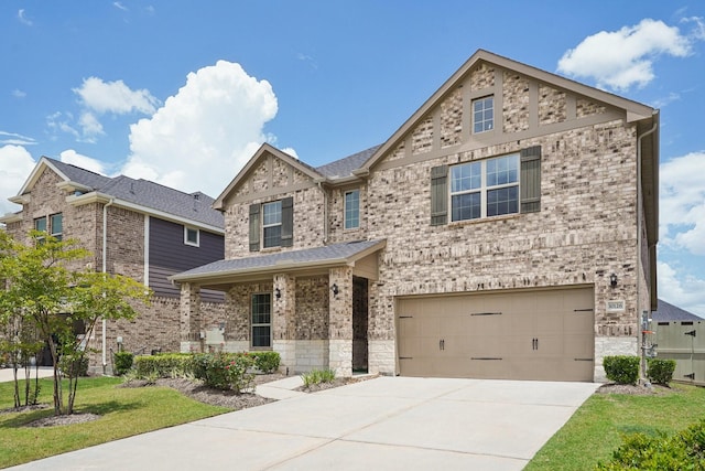 10126 Bayou Oaks Dr, Conroe, TX 77385 - traditional-style house featuring concrete driveway, a garage, brick siding, a front lawn, and stone siding