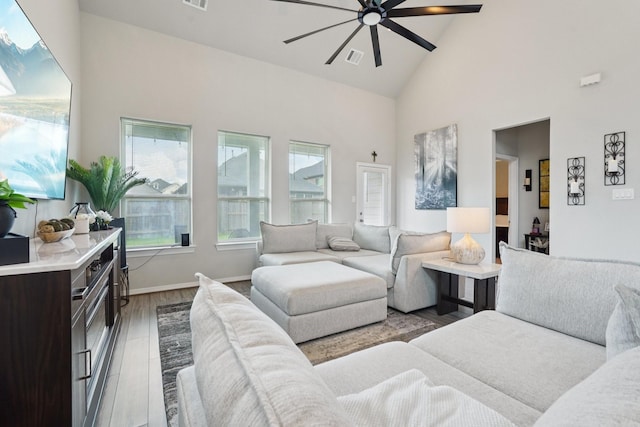 10126 Bayou Oaks Dr, Conroe, TX 77385 - living area with high vaulted ceiling, ceiling fan, and wood finished floors