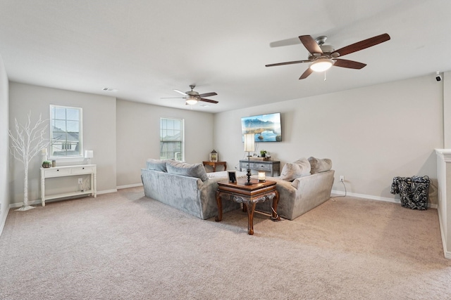 10126 Bayou Oaks Dr, Conroe, TX 77385 - living area featuring ceiling fan, carpet floors, and healthy amount of natural light