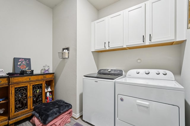 10126 Bayou Oaks Dr, Conroe, TX 77385 - laundry room with washer and clothes dryer and wood finished floors