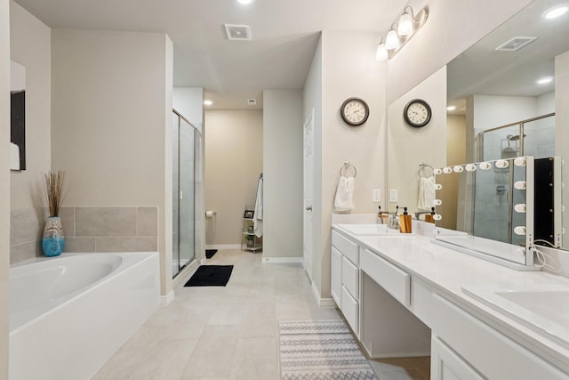 10126 Bayou Oaks Dr, Conroe, TX 77385 - full bathroom with double vanity, a shower stall, a garden tub, tile patterned floors, and recessed lighting