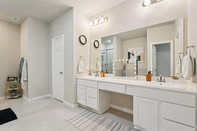10126 Bayou Oaks Dr, Conroe, TX 77385 - bathroom featuring double vanity, a stall shower, and tile patterned floors