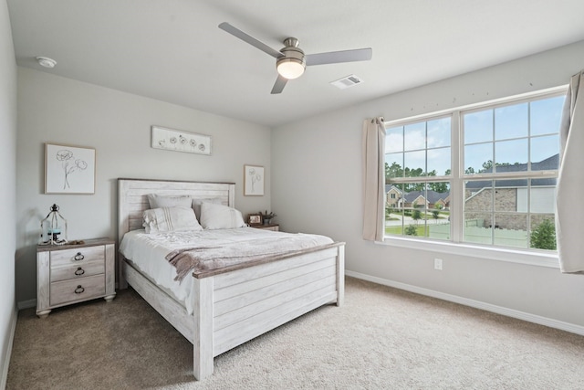 10126 Bayou Oaks Dr, Conroe, TX 77385 - carpeted bedroom with baseboards and a ceiling fan