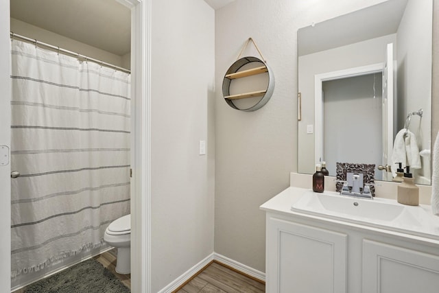 10126 Bayou Oaks Dr, Conroe, TX 77385 - bathroom with wood finished floors, vanity, and curtained shower