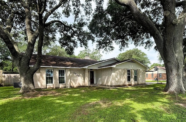1006 Fairlane Dr, Ganado, TX 77962 - ranch-style house featuring brick siding and a chimney