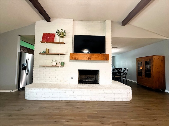 1006 Fairlane Dr, Ganado, TX 77962 - living area featuring dark wood finished floors and a brick fireplace