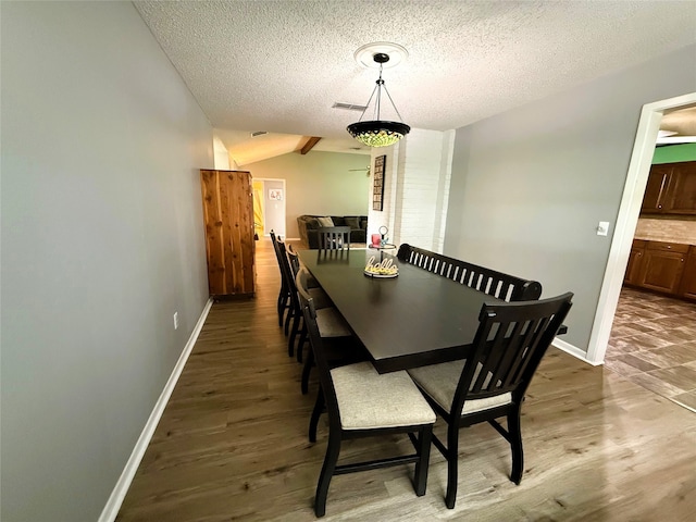 1006 Fairlane Dr, Ganado, TX 77962 - dining space with a textured ceiling, wood finished floors, and lofted ceiling