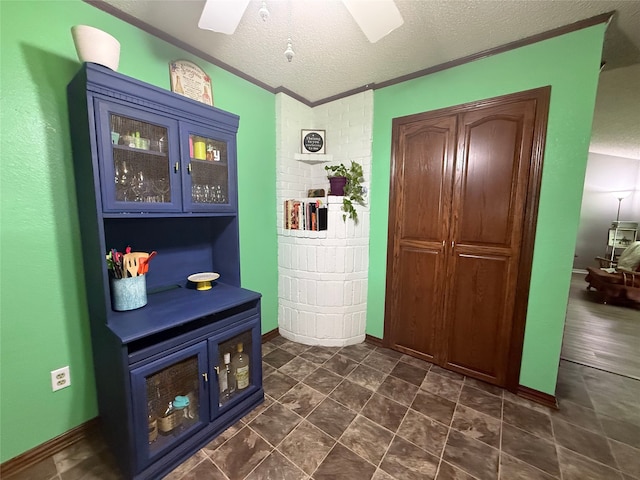 1006 Fairlane Dr, Ganado, TX 77962 - entrance foyer featuring a textured ceiling, crown molding, and ceiling fan