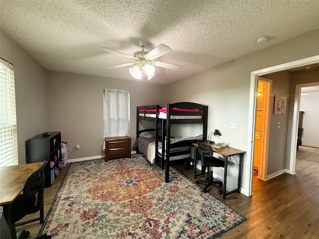 1006 Fairlane Dr, Ganado, TX 77962 - bedroom featuring wood finished floors, a textured ceiling, and ceiling fan