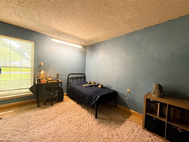 1006 Fairlane Dr, Ganado, TX 77962 - bedroom featuring a textured ceiling and a textured wall