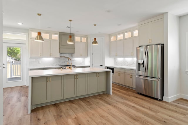 3224 Omega St, Houston, TX 77022 - kitchen with stainless steel refrigerator with ice dispenser, built in microwave, light countertops, tasteful backsplash, and recessed lighting